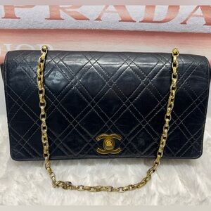 CHANEL Black Quilted Leather Bag with Gold Chain